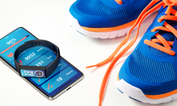 image of fitness tracking wristband, mobile phone, and running shoes